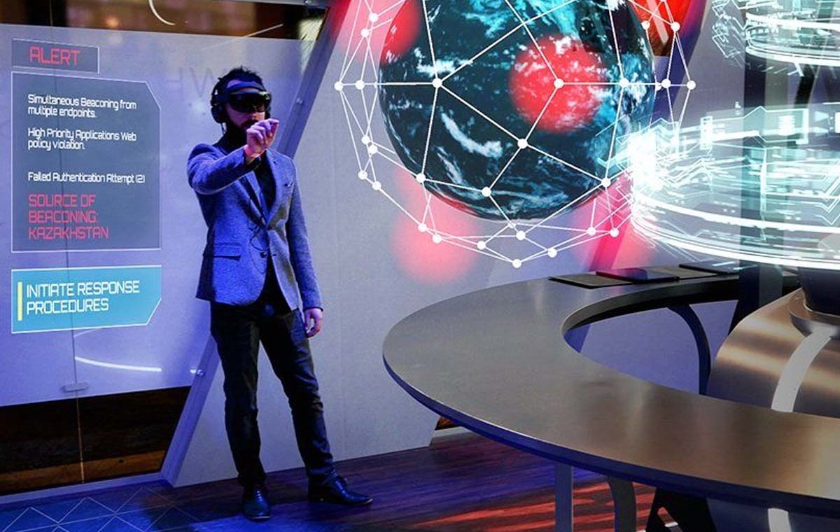 A man in a VR headset engages with a holographic globe interactive at an experiential event